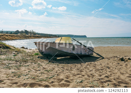 Old paddle boat stands on sand, Baikal lake shore 124292113