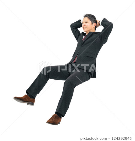 Middle-aged male business person sitting and relaxing. Full-body photo PNG with transparent background precisely cut out by hand. 124292945