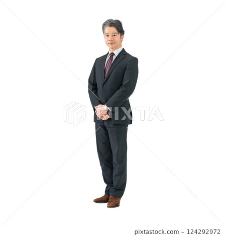 Middle-aged male business person standing at an angle. Full-body photo PNG with transparent background precisely cut out by hand. Middle-aged male business person standing at an angle. Full-body photo PNG with transparent background precisely cut out by hand. 124292972