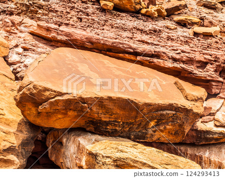 Ancient Bushman engravings adorn the weathered rock surfaces at Twyfelfontein in Namibia, showcasing the artistry and cultural heritage of prehistoric communities in this historic location. Ancient Bushman engravings adorn the weathered rock surfaces at Twyfelfontein in Namibia, showcasing the artistry and cultural heritage of prehistoric communities in this historic location. 124293413