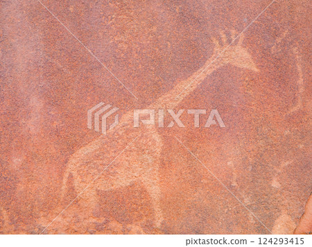 Engravings from the Bushman culture depict a giraffe at Twyfelfontein, showcasing ancient artistry in rock formations, revealing details of their connection to nature. Engravings from the Bushman culture depict a giraffe at Twyfelfontein, showcasing ancient artistry in rock formations, revealing details of their connection to nature. 124293415