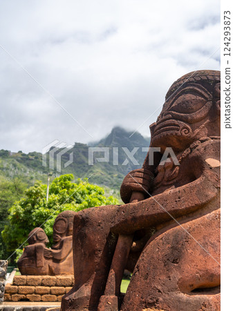 Ancient tiki statue with Mount Temetiu, Hiva Oa, French Polynesia 124293873