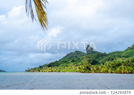Maroe Bay with lush hills and calm waters in Huahine, French Polynesia 124293874