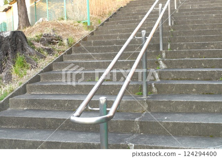 Handrails on steep stairs are safe for small children and the elderly. 124294400
