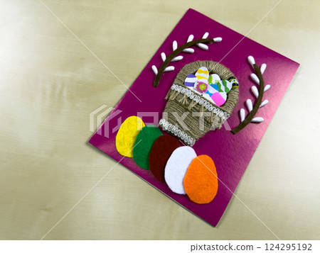 Colorful Easter basket card with felt eggs and flowers Colorful Easter basket card with felt eggs and flowers 124295192