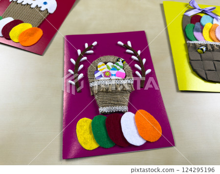 Festive handmade Easter basket card with colorful eggs Festive handmade Easter basket card with colorful eggs 124295196