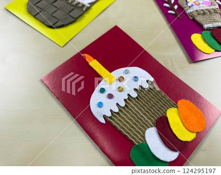 Colorful handmade Easter cake card with felt decorations 124295197