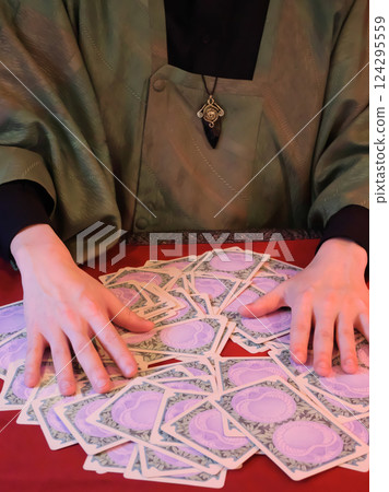 Man doing tarot reading Man doing tarot reading 124295559