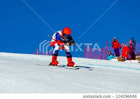 man skier down snow-covered slope during competitive alpine skiing 124296048