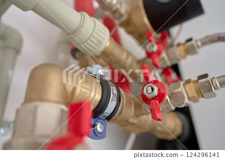 Heating system with brass fittings, pipes, and shut-off valves 124296141