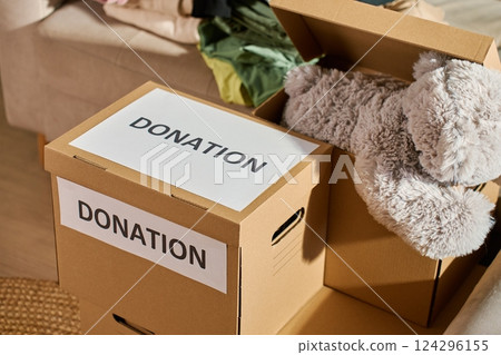 Clothes prepared for donation in cardboard box Clothes prepared for donation in cardboard box 124296155