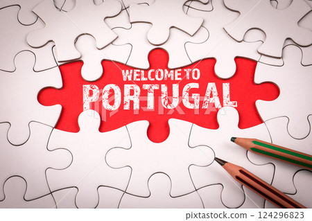 Welcome to Portugal. White puzzle pieces and colored pencils Welcome to Portugal. White puzzle pieces and colored pencils 124296823
