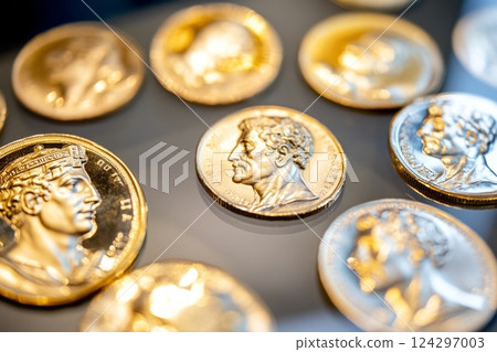 Gold coins representing roman emperors showing history and power 124297003
