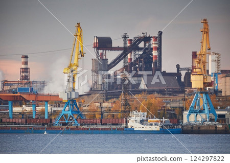 Blast furnace, Metallurgical plant in sunset light. Industrial port with cranes on the river bank. Environmental problems 124297822