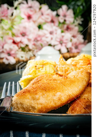 Breaded chicken breast fillet 124297920