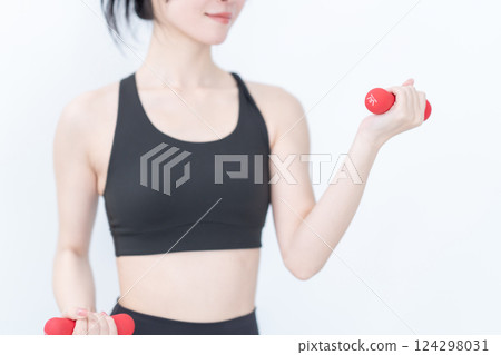 Young woman training with weights, no face, white background 124298031