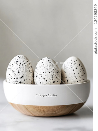 Happy Easter minimalist speckled eggs in ceramic bowl with elegant typography, Happy Easter concept 124298249