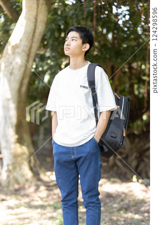 Man walking on campus Man walking on campus 124298596