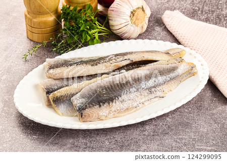 Marinated salted herring fillet apetizer Marinated salted herring fillet apetizer 124299095