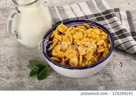 Corn flakes with milk for breakfast 124299245