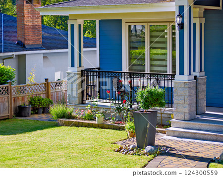 Front yard lawn and corner of residential house on spring season Front yard lawn and corner of residential house on spring season 124300559