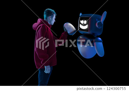 Composite image of young man interacting with 3D model of robot, demonstrating confident alliance between human and artificial intelligence. Composite image of young man interacting with 3D model of robot, demonstrating confident alliance between human and artificial intelligence. 124300755