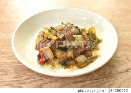 spicy stir fried ostrich meat with onion and black pepper on plate spicy stir fried ostrich meat with onion and black pepper on plate 124300915