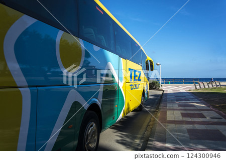 Spain, Lloret de Mar - September 20, 2017: TEZ TOUR tourist company bus with a view of the beach and the sea 124300946