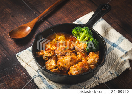 Skillet-made chicken stew with tomato Skillet-made chicken stew with tomato 124300960