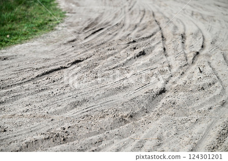 Multiple Bicycle tire tracks in a sandy road Multiple Bicycle tire tracks in a sandy road 124301201