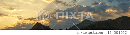 Tropical sunset in the mountains. Magic clouds. Fairytale view. Tropical sunset in the mountains. Magic clouds. Fairytale view. 124301932
