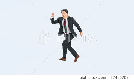 Full-body photo of a middle-aged male business person jumping energetically 124302051