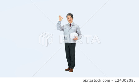 Full-body photo of a middle-aged male worker holding a helmet and showing an OK sign 124302083