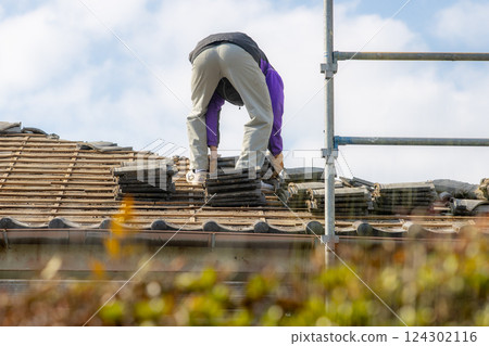 A tiler replacing tiles A tiler replacing tiles 124302116
