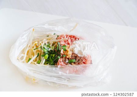 Gyoza filling made in a plastic bag Gyoza filling made in a plastic bag 124302587