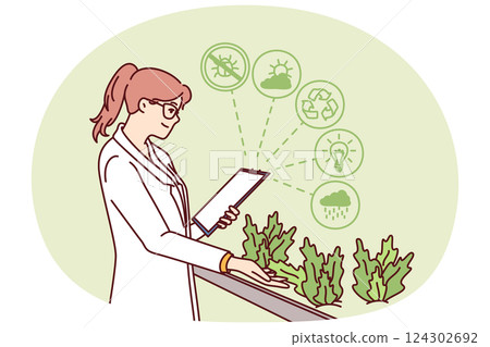 Woman works in hydroponic plant farm growing plants in biological research laboratory 124302692