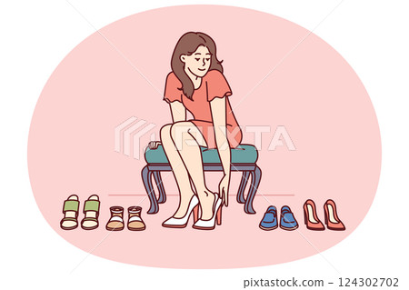 Shopaholic woman is trying on shoes in store choosing right high heels for going to party Shopaholic woman is trying on shoes in store choosing right high heels for going to party 124302702