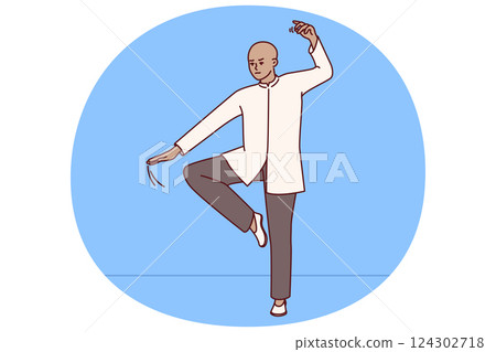 Chinese man practicing qi qong taijiquan does breathing exercises during martial arts training Chinese man practicing qi qong taijiquan does breathing exercises during martial arts training 124302718
