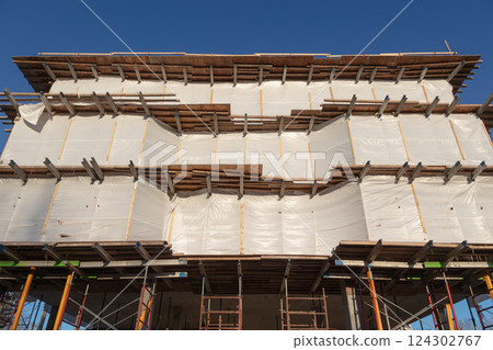 Building Under Construction Corner with Metal Beams and Scaffolding 124302767