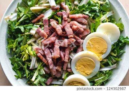 Dandelion salad with hard-boiled eggs and bacon, diuretic, vitamin, healthy food 124302987