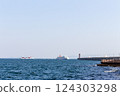 Under the blue sky, a ferry departing and arriving at the Seto Inland Sea as seen from the quay of Sunport Takamatsu 124303298