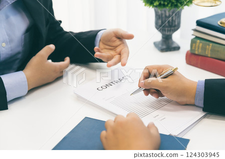 Businessman and lawyer discussing the contract. Sign a contract business. Treaty of the law. Law and Legal services concept. 124303945