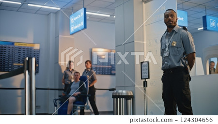 Airport Terminal: Security Officer Inspecting Young Man with Prosthetic Leg in Wheelchair Airport Terminal: Security Officer Inspecting Young Man with Prosthetic Leg in Wheelchair 124304656