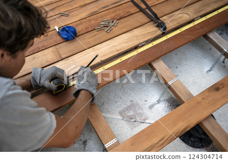 Precise wooden deck construction in progress 124304714