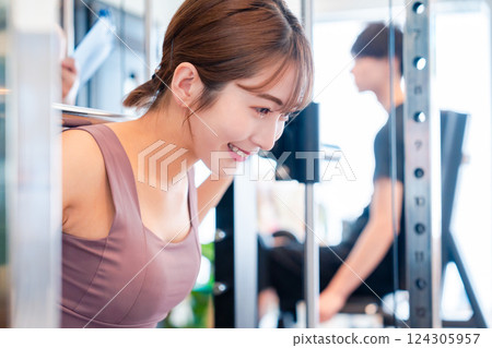 Young woman working out at the gym Young woman working out at the gym 124305957