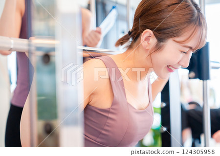 Young woman working out at the gym Young woman working out at the gym 124305958
