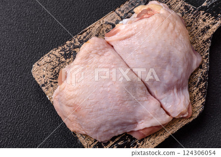 Fresh raw chicken thighs with salt and spices Fresh raw chicken thighs with salt and spices 124306054