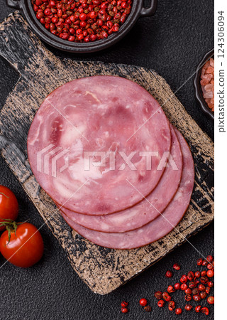 Boiled ham with salt and spices cut into slices Boiled ham with salt and spices cut into slices 124306094