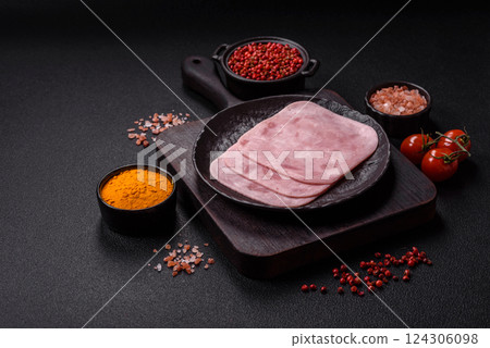 Boiled ham with salt and spices cut into slices 124306098