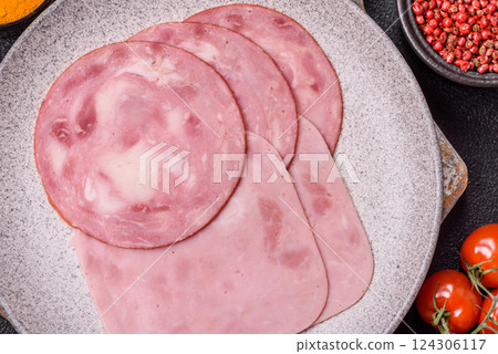 Boiled ham with salt and spices cut into slices Boiled ham with salt and spices cut into slices 124306117